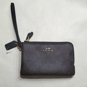 Double corner zip Coach wristlet. Signature brown water repellent fabric.